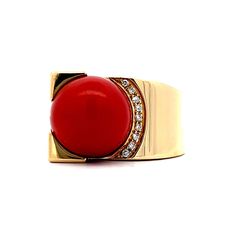 This unique asymmetrical cocktail ring is a vintage classic! Crafted in 18 karat yellow gold, the ring features a round cabochon coral at its center. The coral is surrounded by nine (9) sparkling round brilliant cut diamonds. The diamonds are nestled amongst a sculptural display of polished yellow gold, creating an eye-catching asymmetrical design. A statement-making cocktail ring that celebrates the beauty of coral and diamonds! Elegant Red Dome Ring For Formal Occasions, Elegant Red Dome Ring For Anniversary, Elegant Red Signet Ring For Formal Occasions, Formal Red Domed Rings, Elegant Round Cabochon Signet Ring, Luxury Red Ring With Bezel Setting, Formal Red Dome Ring, Luxury Red Round Signet Ring, Coral Rings For Women Gold