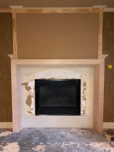 an empty fireplace in a room with no one around it and the wall is missing