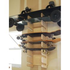 a skateboard is mounted to the side of a wall with wheels on it's sides