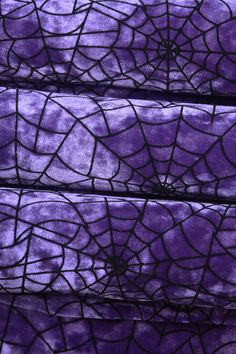 purple and black spider web fabric