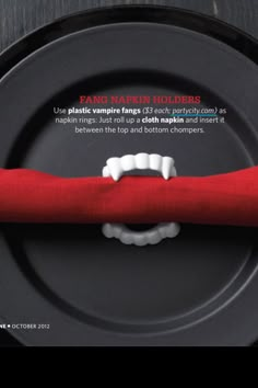 a black plate with a red cloth on it and a white toothbrush in the middle