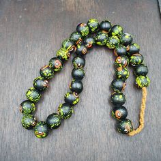 Vintage Trade Floral Green, Black Glass Beads Beaded Necklace vintage African Trade GLASS Beads Beaded Necklace Strand  * BEADS:APPROXIMATELY 36 PCS * Size: 17.5-18mm * Color : Multi Color * Full Strand     INFORMATION                        SHIPPING,PAYMENT,                        RETURN,FEEDBACK 1:We Freely Ship all our items to all over the world via USPS OR Airmail Register Thailand with providing tracking numbers 2:we ship worldwide within 2 business days after receiving cl Black Beaded Jewelry For Beach, 8mm Beads, Black 8mm Beads Beach Jewelry, Black Beach Jewelry With 8mm Beads, Black Artisan Necklaces For Beach, Black Artisan Necklace For Beach, Artisan Black Necklace For Beach, Black Round Beads Jewelry For Beach, Black Beaded Bracelets With Large Beads For Beach, Black Beaded Necklaces For The Beach