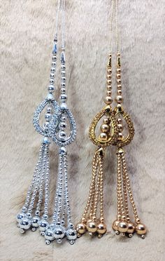 Indian Handmade Latkan Tassels for Saree Blouse Lehenga HandBags Hangings Dupatta Decoration Bridal Wedding dress for Women pair of 2 pcs Size - 23 cm Length  Item Description You can use this Beautiful pair of tassle for several DIY projects.  *These beautiful Tassel Latkans are used as the accessory for saree blouse on the back, but u can use according to your need and your innovative ideas. * Package contains 2 Latkan / 1 Pair Other Than Saree Blouse, you can use these latkans in various ways Craft Projects Designing Home Decoration Festive celebrations. Evening and party Apparels. Home décor items Apparel & Fashion Scarves n Stoles Headband, hats Table cover, curtains, Pillow covers, Cushion cover Shoe designing Headband, hats Table cover, curtains Designing stylish blouses Ship From N Luxury Necklace With Latkans For Gift, Tassels For Saree, Latkan Tassels, Dupatta Bridal, Wedding Dress For Women, Sari Lehenga, Blouse Lehenga, Stylish Blouses, Bridal Wedding Dress