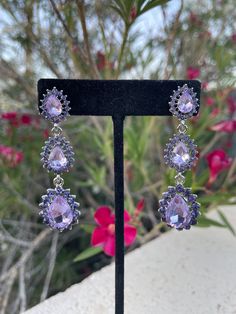 Purple Drop Chandelier Earrings For Formal Occasions, Elegant Lavender Jewelry For Evening, Glamorous Purple Jewelry For Evening, Elegant Lavender Evening Jewelry, Purple Rhinestone Crystal Earrings For Party, Party Purple Crystal Rhinestone Earrings, Purple Bridal Earrings For Party, Purple Jewelry With Sparkling Stones For Party, Elegant Lavender Crystal Earrings For Party