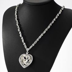 This high quality sterling silver Italian made chain features diamond cut moon shape cuts into the beads. This incredible detailing gives you a unique sparkle and shine once the light hits the chain. Its a small 2mm size chain that's good for mini or micro pendants. This chain is rhodium plated and gives you the exact look and feel of a white gold chain. Precious shiny added thanks to the round stone and the following 16x16mm heart cut moissonite below 925 Sterling Silver (Rhodium Plated) 2mm Wi Crystal Heart Cut Jewelry With Heart Charm, Heart-shaped Chain Jewelry For Weddings, Heart-shaped Diamond White Crystal Jewelry, Silver Crystal Heart Pendant Jewelry, Silver Crystal Heart Necklace, Silver Heart-shaped Crystal Jewelry, Silver Heart Pendant Chain Necklace With Adjustable Chain, Silver Crystal Heart Necklace For Wedding, Gift Crystal Chain Necklace With Sparkling Stones