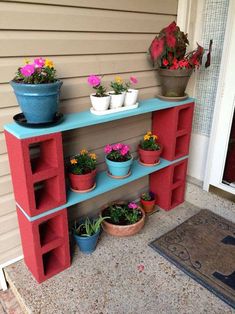 an outdoor shelf with potted plants on it