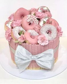 a cupcake decorated with pink frosting and flowers