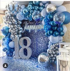 balloons and streamers decorate the backdrop for an 18th birthday party