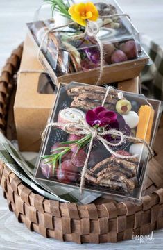 some food is wrapped in clear plastic and tied with twine on top of each other