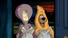 two cartoon characters dressed in costumes standing next to each other