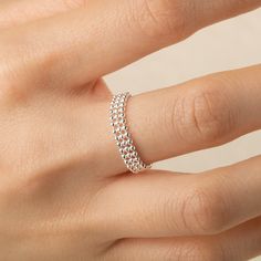 This adjustable chain ring is a delicate and refined piece, offering the perfect balance of elegance and versatility. The design allows for subtle adjustments, ensuring a comfortable fit on any finger, while the shimmering silver catches the light, adding a touch of sparkle to your hand. Its timeless design is suitable for both casual and formal occasions, and its lightweight structure promises all-day comfort. Materials:  s925 Sterling silver  Cyan Art Store creates dainty jewelry that is inspired by antique and tribal designs from around the globe.   All of our pieces are handmade so keep in mind that the final product might deviate slightly from the pictured product. Adjustable Sterling Silver Dainty Chain Ring, Adjustable Dainty Sterling Silver Chain Ring, Adjustable Minimalist Open Chain Ring, Dainty Stackable Chain Ring, Silver Minimalist Chain Ring For Wedding, Minimalist Silver Chain Ring For Wedding, Minimalist Adjustable Chain Ring For Weddings, Minimalist Adjustable Wedding Chain Ring, Delicate Rings With Adjustable Chain