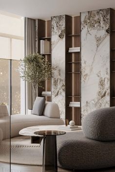 an elegant living room with marble walls and floor to ceiling bookshelves in the corner