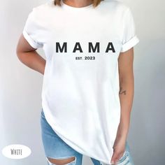 Show off your love and excitement for the upcoming arrival of your newest family member with our Mama est 2023 Tee. Crafted from high-quality materials, this comfy and stylish tee is the perfect pregnancy announcement. Click to buy now and start looking forward to the day your little one arrives. Mommy Shirts, Pregnancy Reveals, Pregnancy Announcement, Looking Forward, Mom Shirts, New Moms, Jersey Shorts, San Jose, Mother's Day Gifts