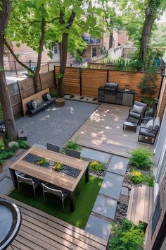 an outdoor patio with tables, chairs and grilling area in the back yard is surrounded by trees