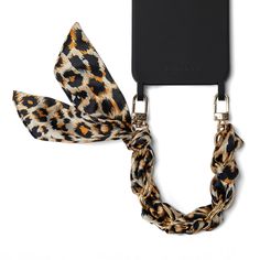 The perfect accessory for any occasion, the Sophie Wristlet in Leopard is crafted with luxurious fabric and a stunning metal design. Carry your phone handsfree in style and flaunt its sleek and classic design. You'll love the convenience and charm of this phone wristlet! Features: Length: 25 cm / 9.8 in Detachable Phone Case not included. Elegant Rectangular Wristlet Mobile Phone Bag, Elegant Rectangular Wristlet For Mobile Phone, Elegant Rectangular Mobile Phone Wristlet, Trendy Gold Rectangular Wristlet, Elegant Black Mobile Phone Bag Accessories, Elegant Adjustable Rectangular Wristlet, Elegant Black Rectangular Phone Accessories, Elegant Gold Rectangular Wristlet, Phone Wristlet