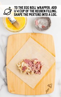 an egg roll wrapper is shown on a cutting board next to eggs and other ingredients