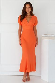 Length from shoulder to hem of size S: 146cm. Chest: 46cm, Waist: 32cm, across front only of size S. Maxi dress. Lined. Model is a standard XS and is wearing size XS. True to size. Non-stretch. Elastic cuffs to sleeves. Cutout to back with elastic. V-neck. Button closure at back of neck. Zipper with hook eye closure. Cold hand wash only. Polyester. Long summer days done right in the Gilded Maxi Dress. Featuring elastic cuffs to the sleeves, a cutout to the back, and a gorgeous V-neck. Style with First Day Outfit, Brunch Dress, Bridal Shower Dress, Shower Dresses, Jumpsuits And Romper, Dress Orange, Long Sleeve Lace Dress, Pink Mini Dresses, Dress Cuts