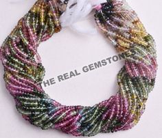 multicolored seed bead necklace with white ribbon on the front and back side