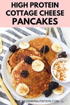 high protein cottage cheese pancakes on a plate with berries and syrup