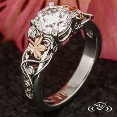 a close up of a ring with flowers on it