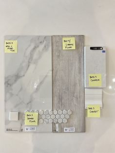 several pieces of marble with sticky notes attached to the sides and on top of each other