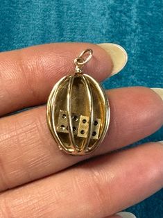 Thank you for viewing Wrenn Estate  Such fun! This 14k yellow gold pendant opens so you can shoot the little dice!!  Excellent addition to your charm collection! Hallmarked "14k" 1 1/4 x 3/4 inch  5.6 grams 14k yellow gold  See photo with ruler for size  Vintage jewelry has been worn and may show signs of wear. Please review the pictures to examine the jewels size and condition. All fasteners and clasp are working unless otherwise noted Antique 14k Gold Charms For Collectors, Victorian Yellow Gold Charms For Gifts, Victorian Yellow Gold Charms For Gift, Vintage 14k Gold Charms For Gift, Nickel Free Yellow Gold Jewelry For Collectors, 14k Yellow Gold Charms For Collectors, Antique Good Luck Charms Jewelry, Vintage Good Luck Locket Jewelry, Vintage 14k Stamped Charms For Gift