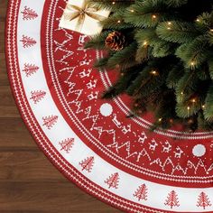 a christmas tree skirt with pine cones on it