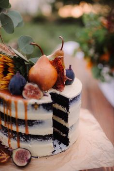 there is a cake with fruit on it