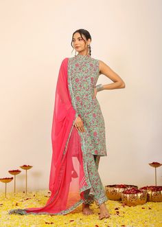 *Immerse yourself in the kaleidoscope of multi-colored florals with our meticulously crafted print, designed to turn every day into a blossoming celebration.  *The three-piece set is a testament to modern elegance, featuring a sleeveless kurta adorned with a high neckline.  *The relaxed fit ensures both comfort and style, creating an effortlessly chic silhouette that allows you to move with grace and confidence.  *The coordinating pant continues the floral story, while the pink dupatta adds a to Red Digital Print Unstitched Wedding Suit, Festive Fitted Salwar Kameez With Kalamkari Print, Multicolor Printed Unstitched Suit For Summer, Summer Multicolor Printed Unstitched Suit, Green Digital Print Unstitched Suit For Festivals, Green Digital Print Unstitched Suit For Festive Occasion, Multicolor Unstitched Suit With Digital Print Straight Kurta, Multicolor Unstitched Suit With Digital Print, Red Unstitched Wedding Suit With Digital Print