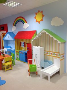 there are many toys in the playroom with different colors and shapes on the walls