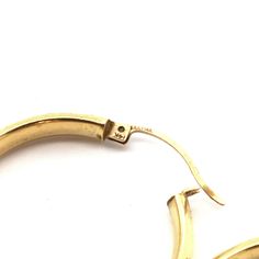 Surprise someone special (or treat yourself) with these classic gold hoops! These fun and sassy 14 karat solid yellow gold faceted hoop earrings are 29.6 millimeters (1 3/16 inches) in diameter by 4.8 millimeters (3/16 inch) wide. (Note that they are solid in the sense of not plated or filled, but the tubes themselves are likely hollow.) The pair together weighs 4.1 grams. They are stamped 14K and signed by the maker. Expected light scratches can be polished out; otherwise, excellent estate cond Classic 14k Stamped Hoop Earrings, Classic Yellow Gold Hoop Earrings For Anniversary, Gold Hoop Earrings Stamped 14k For Anniversary, Gold 14k Stamped Hoop Earrings For Anniversary, Formal 14k Stamped Hoop Huggie Earrings, Classic Yellow Gold Hoop Earrings Stamped 14k, Classic Pierced Hoop Earrings For Anniversary, Small 14k Stamped Hoop Earrings For Anniversary, Anniversary 14k Stamped Small Hoop Earrings