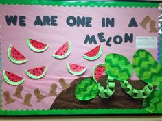 a bulletin board with watermelon slices on it and the words we are one in a melon