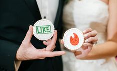 the bride and groom are holding decorated cookies with words like i love you on them