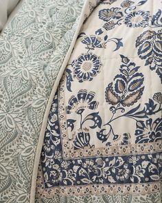 the comforter is made up with blue and white designs on it's sides