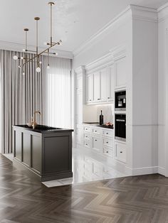 an empty kitchen with white cabinets and wood flooring is pictured in this image, there are lights hanging from the ceiling