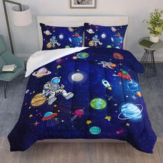 an image of a bed set with outer space theme