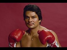 a man wearing boxing gloves posing for a photo