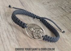 a bracelet with an image of jesus on it and the words choose your saint & cord color