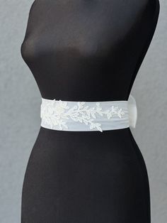 Wedding belt with train |Tulle Bow Bridal Sash | Ivory Bow Belt | Wedding Dress Sash| Over-sized Bow  Rhinestone Belt | Crystal Dress Sashes A stunning, elegant statement wedding sash is exquisitely beaded in beautiful vintage pattern. Your choice tulle  sash is attached to the beading and ties at the back into a bow.  An ultimate luxurious accent piece for your wedding dress or for any special occasion dresses. Accentuate your waist and add a touch of feminine charm to any dress with this tulle sash. Even the most simple gown can transform into a dreamy ensemble with this voluminous bow. Color embroidery - ivory Color tulle on photo - ivory The belt is made as a long ribbon that you can tie around your waist. White Wedding Dress With Sashes, Fitted Lace Bridal Belt For Bride, Fitted Lace Bridal Belt For Ceremony, White Bridal Belt For Bride, Elegant Ribbon Bridal Belt For Wedding, Elegant Fitted Lace Bridal Belt, Elegant Lace Fitted Bridal Belt, White Fitted Bridal Belt For Ceremony, Wedding Bridal Belt With Sashes In Satin