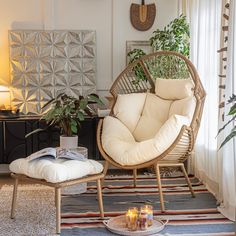 a living room filled with furniture and plants