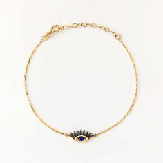 Timeless and elegant, our dainty Sapphire Evil Eye Bracelet in 14K Gold is the epitome of luxury charm bracelets for women. Crafted with precision, this delicate 14k yellow gold bracelet serves as the perfect gift for her, offering both protection and style. Its radiant sapphire gemstone, encased in solid gold, effortlessly enhances any ensemble, making it a must-have accessory for every jewelry collection. 14k solid gold handcrafted pieces 100% ethical sourced jewelry Material: 14k Solid Gold & Delicate 14k Gold Bracelet, Tarnish Resistant, Delicate 14k Gold Tarnish Resistant Bracelet, Delicate 14k Gold Tarnish-resistant Bracelet, Dainty Gold-plated Diamond Bracelet Tarnish Resistant, Delicate 14k Yellow Gold Chain Bracelet, Adjustable 14k Gold Evil Eye Bracelet, Elegant 14k Gold Evil Eye Bracelet Gift, Dainty Yellow Gold Sterling Silver Bracelets, Elegant Yellow Gold Evil Eye Bracelet