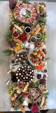 a platter filled with lots of different types of food on top of a table