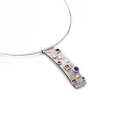 This modern pendant measures at approximately 48mm in length and 10mm in width. It is fun and funky and looks great with the Meg Series earrings! I set a 4mm cabochon stone, slightly offset on the bottom half of the necklace. Comes with a 16 inch or 18 inch omega chain. Prices include: Amethyst, Blue Topaz, Citrine, Garnet, Iolite, Peridot, Pink Tourmaline Any stone is available upon request. Please contact us regarding pricing and availability. Modern Cabochon Necklaces For Gifts, Modern Cabochon Pendant Jewelry, Modern Jewelry With Round Cabochon Pendant, Modern Cabochon Round Pendant Jewelry, Modern Cabochon Round Pendant, The Meg, Modern Pendant, Pink Tourmaline, Blue Topaz