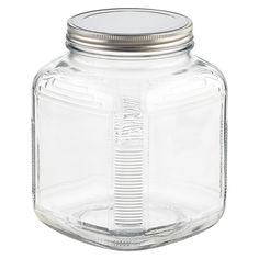 an empty glass jar with a metal lid