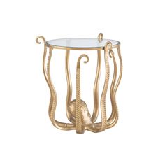 an octopus side table with glass top and gold metal legs, on a white background