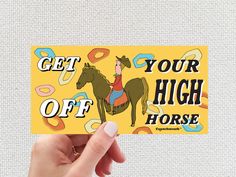 someone holding up a sticker that says get off your high horse