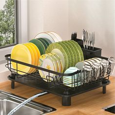 the dish rack is full of clean dishes