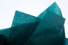 an abstract photograph of blue paper folded in half