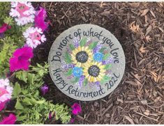 a memorial stone with flowers and the words, hope for what you do is happy retirement