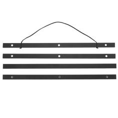 three black metal strips hanging on a white wall